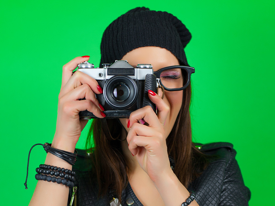 Photo of a photographer taken on a bright green screen