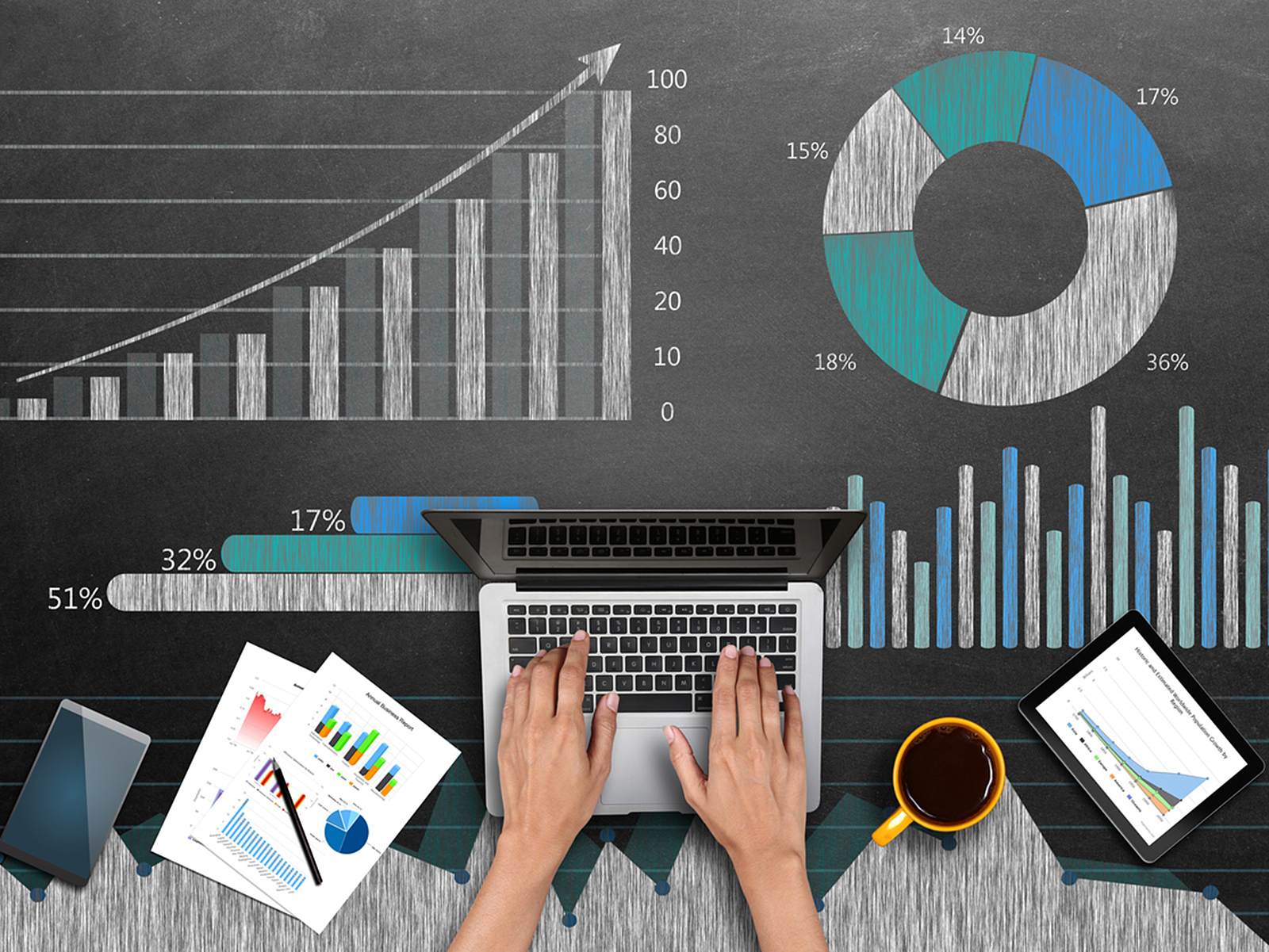 Hands typing on a laptop - Stats and charts in the background