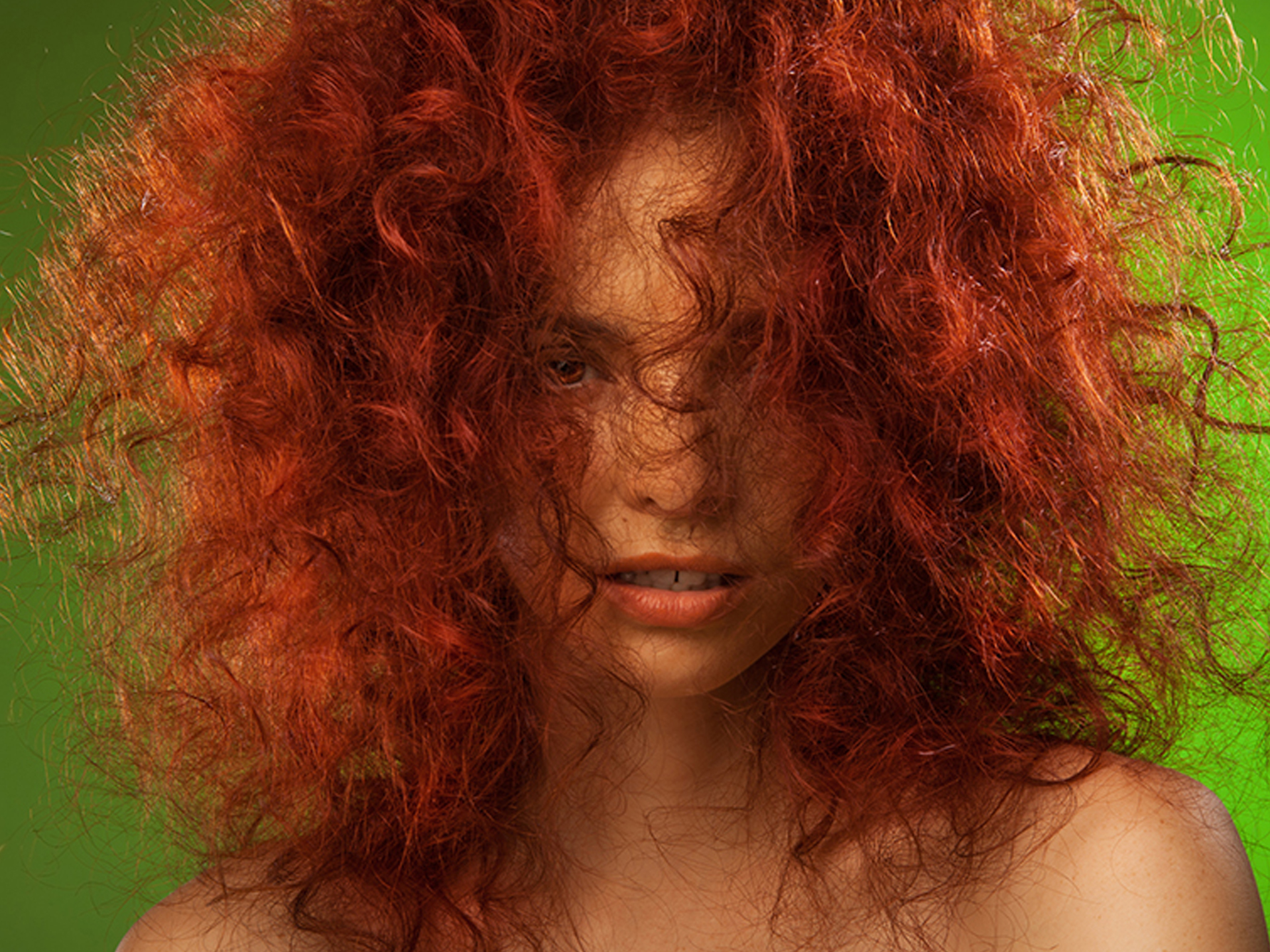 Woman with red hair on green screen