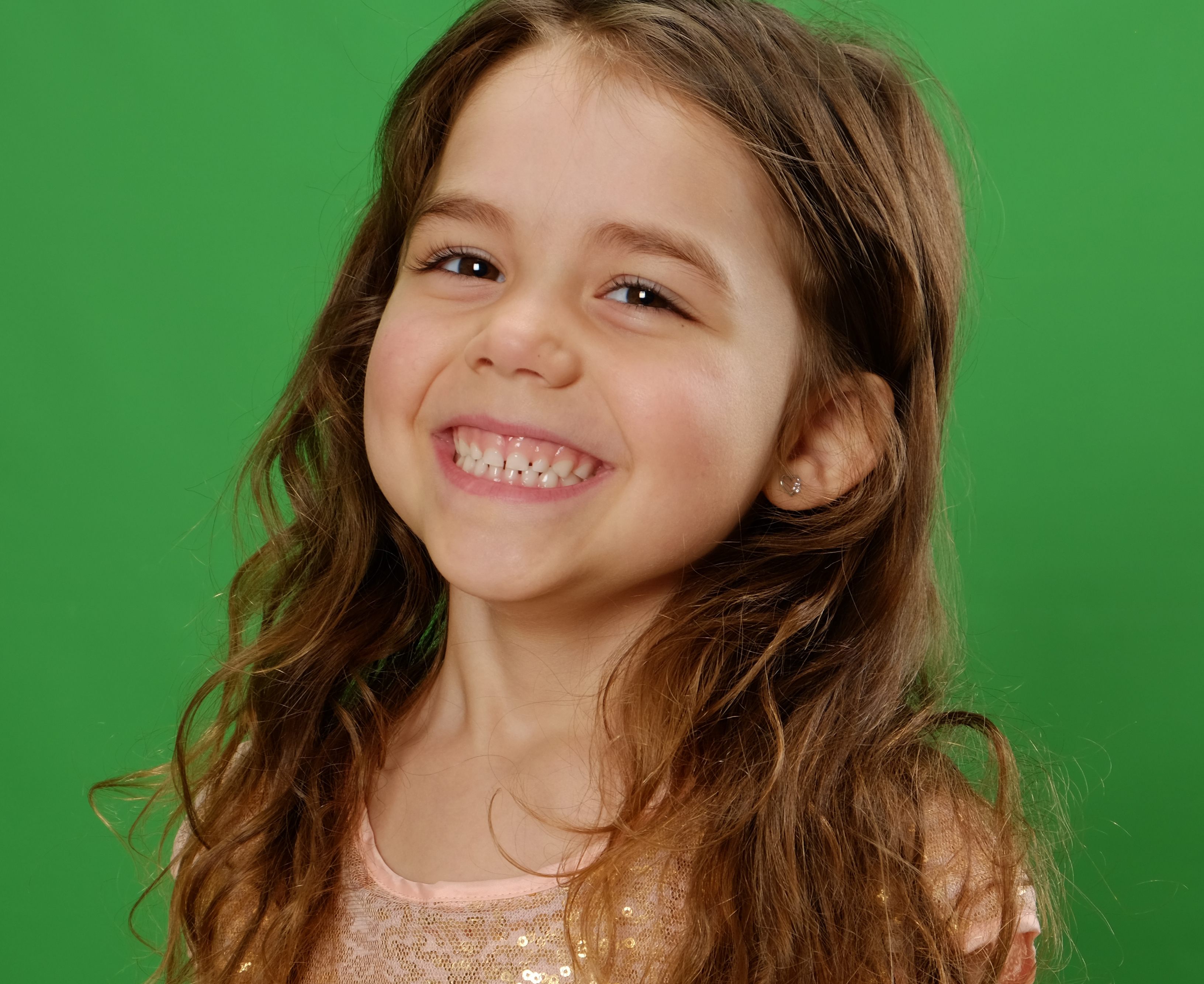 Girl smiling on green screen