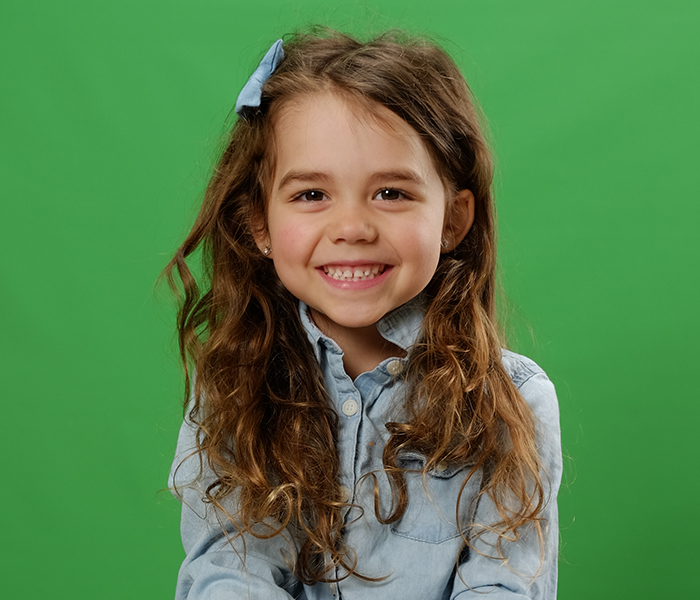 Girl with brown hair on green screen background