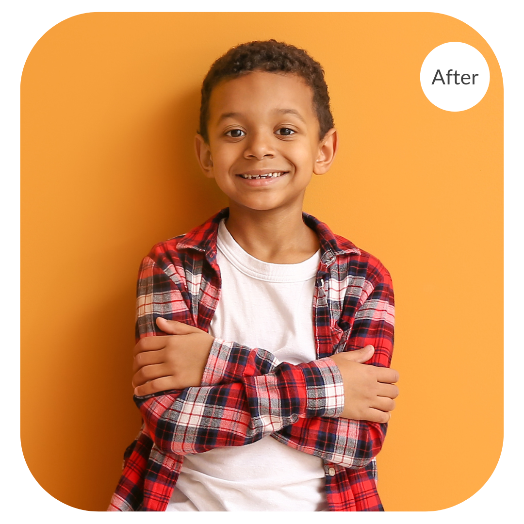 Portrait of a boy in aplaid shirt against an orange background after the image has been color corrected by 36Pix