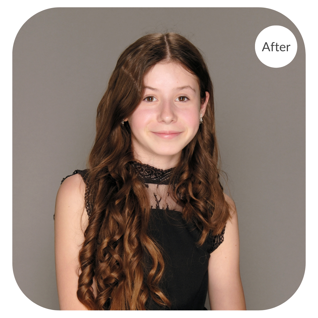 Portrait of a girl with long brown hair against a grey background after the image has been color corrected by 36Pix