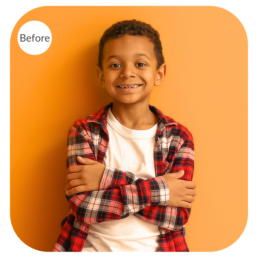 Portrait of a boy against an orange background before the image is color corrected
