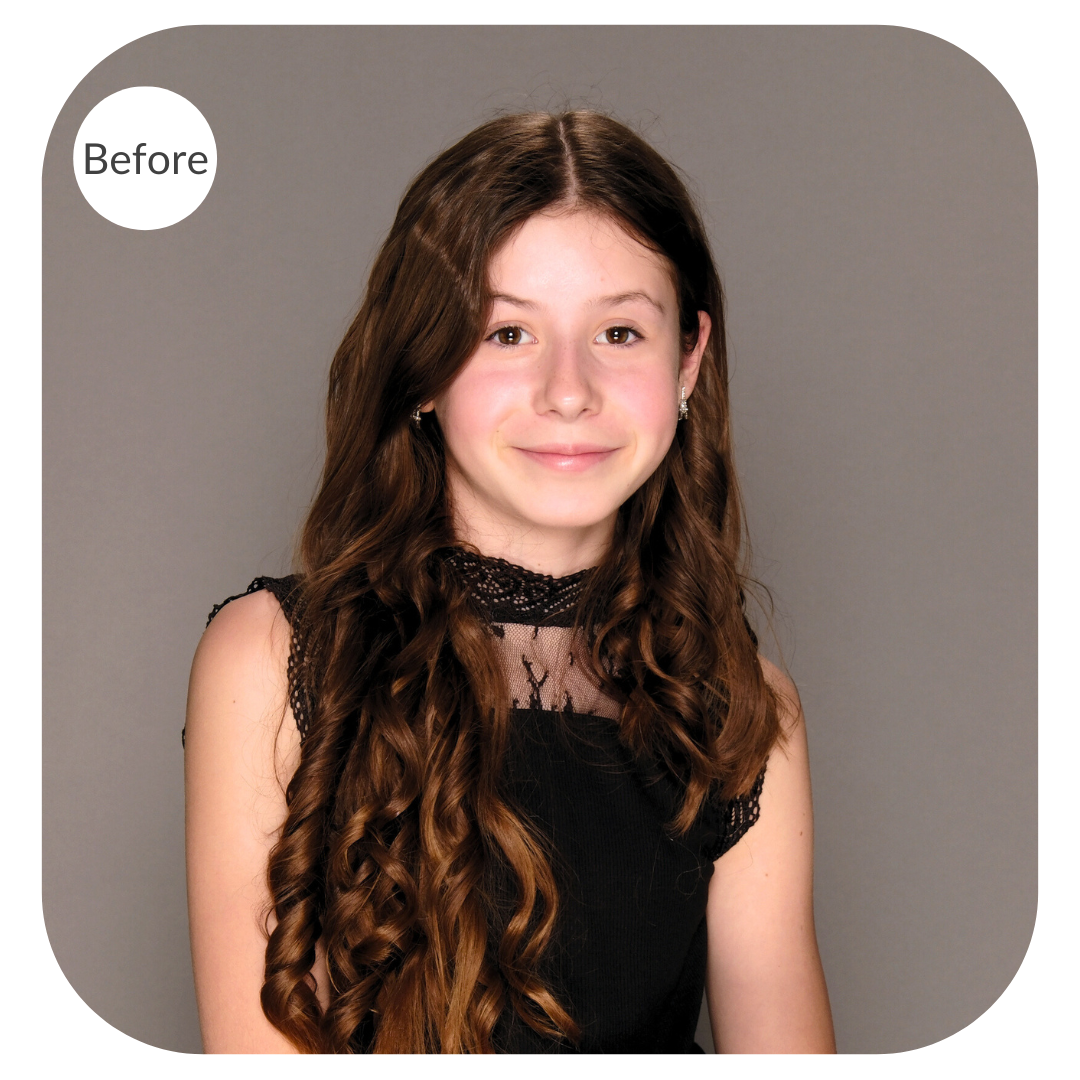 Portrait of a girl with long brown hair against a grey background before the image is color corrected