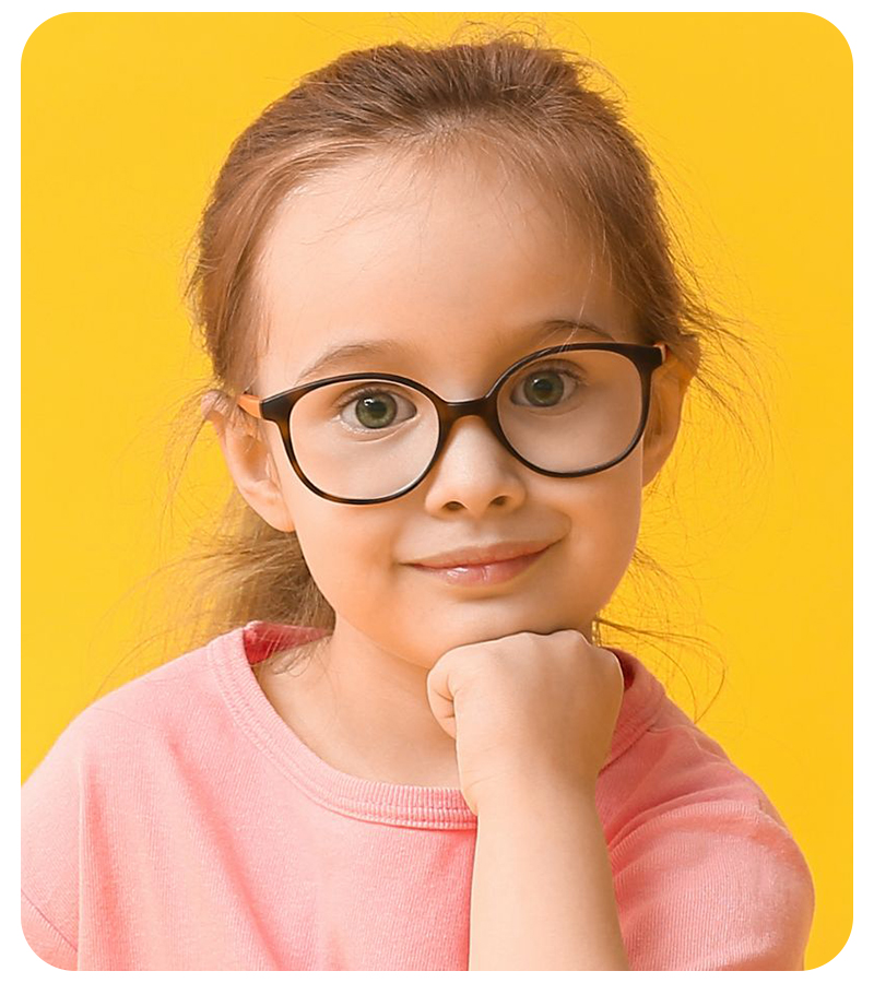 Portrait of a young girl in a pink shirt on a yellow background wearing glasses which have had the glasses reflection removed by 36Pix